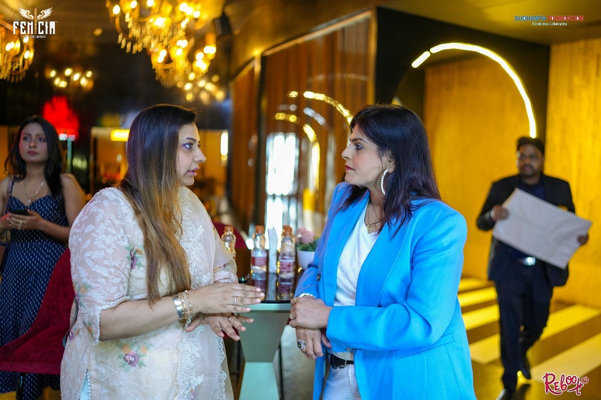 Two women in conversation at a Sahaara event