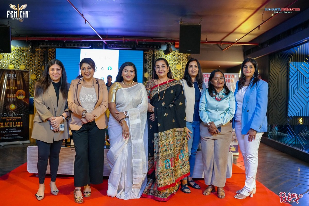 Women from the Project Sahaara community standing together at a Kolkata event